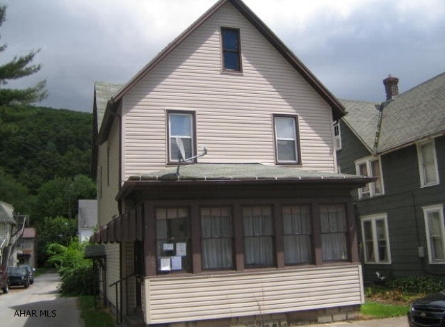Large 2 Story Tyrone home in need of TLC. Vinyl siding, thermo windows, hardwood floors. First floor bath and laundry. Could be perfect with your hard work. Needs TLC. Being sold AS-IS. Seller will make no repairs.  This property is now under auction terms. Pre-sale bids should be submitted through www.Auction.com. This property is subject to a 5% buyer's premium pursuant to the Auction Terms & Conditions (minimums may apply). Please note that the commission percentages may change between the pre-sale and auction periods so please contact listing agent to verify exact commission terms. All auction assets will be sold subject to seller approval. Please contact listing agent for details.