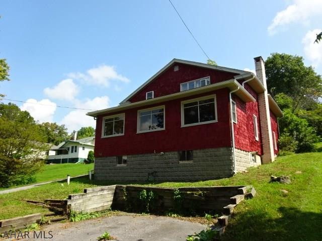 Nice home in Lakemont area. If you love wood, you will love the interior of this home with all wooden handcrafted interior walls and ceilings and pass through bar in kitchen. Two of three bedrooms on second floor have built in dresser drawers and one has a  built in bench. Plenty of room to entertain on the rear screened in porch or built in front porch with gas fireplace. Newer central air. All appliances are included. GLA taken off of tax card.