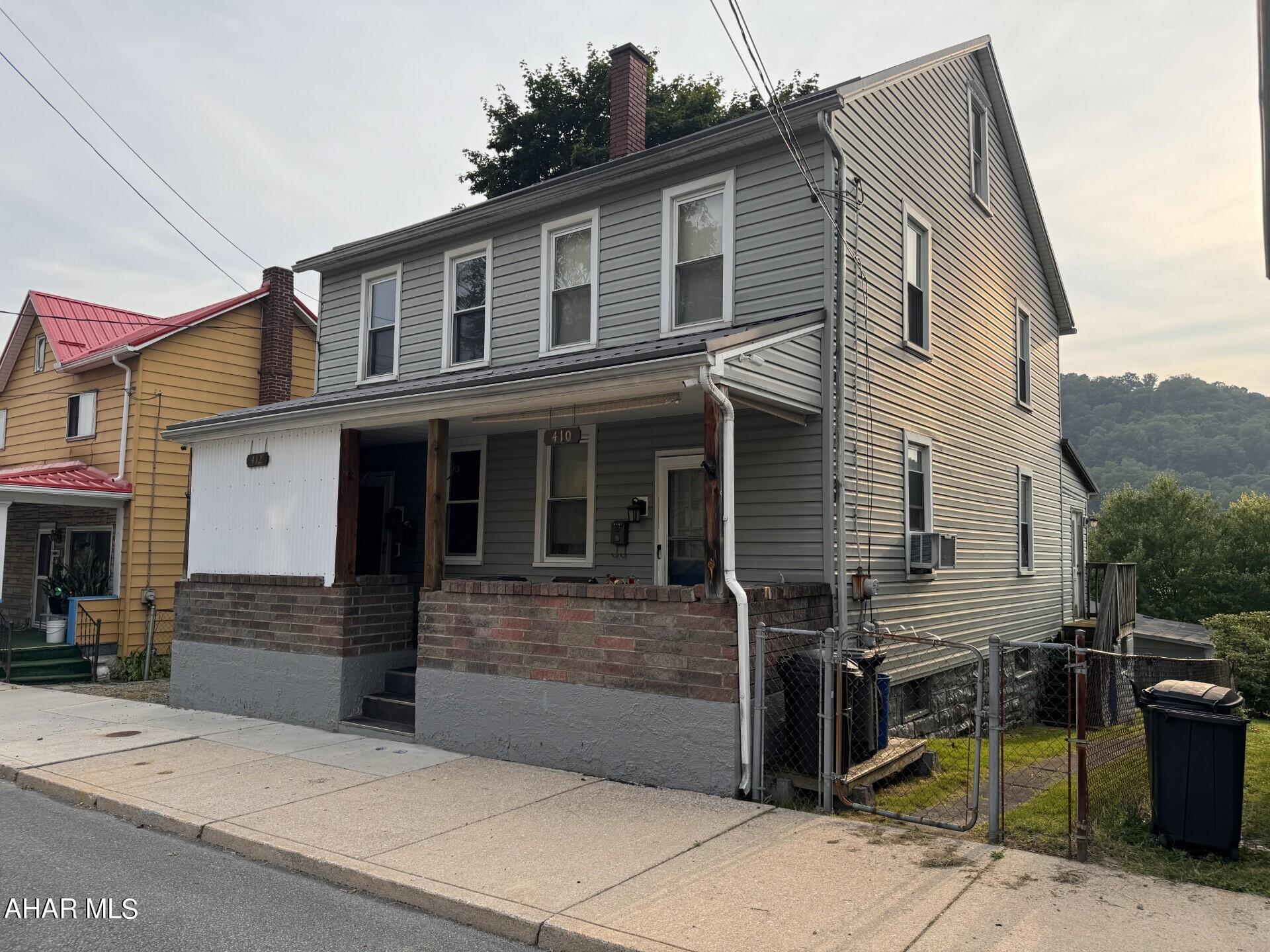 Live in one side & rent the other side to help pay the mortgage!  Also would be great for in-law suite next door.  Third option is as an investment property.  3 car detached garage.  Front porch & back concrete patio.