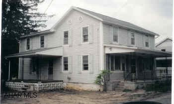 Two-story vinyl home. 5 BR/1 1/2 BA.