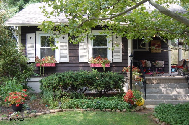 Adorable Cape Cod in desirable neighborhood. Beautifully landscaped. If you are looking for a low maintenance home with great charm - you just found it.  Newer furnace still under warranty.  Roof only 4 years old.