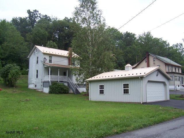 Great starter home or a perfect hunting and fishing retreat!!! Very nice and well maintained home with a Honey Oak kitchen. Spacious 2 car detached garage with openers. New furnace and duct work 2006. City sewer, new water pump and well tank, newly paved driveway for off street parking. Laundry in basement.  Only 10 miles from to Lake Raystown Resort, within minutes of State Game Lands and located next to the Raystown Branch of the Juniata and near Yellow Creek. Abundance of Fishing and Hunting all around.