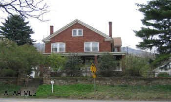 4 Bedroom Brick Home with Lots of Character and Assorted Fruit Trees.  4 Stall Horse Barn, Out Buildings, 2 Car Garage on Acre Lot.  Coal, Wood, Oil Heat.  Water Type is Cistern and Private Well.