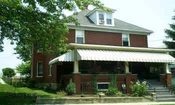 2 1/2 story,5 bedroom,level fenced in yard,flagstone patio Original stained oak trim, replacement windows except for the stained and leaded glass windows, updated electric, lots of character.