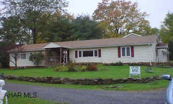 Vinyl sided rancher, 2 car garage, loft over garage.
