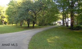 Beautiful split level with private setting on 3.7 acres. Oversized int garage with paved drive, 5 zone hw heat, 2x6 walls, vaulted ceiling, oak flooring, whirpool bath, too much to list. Approx 3000 sq ft.