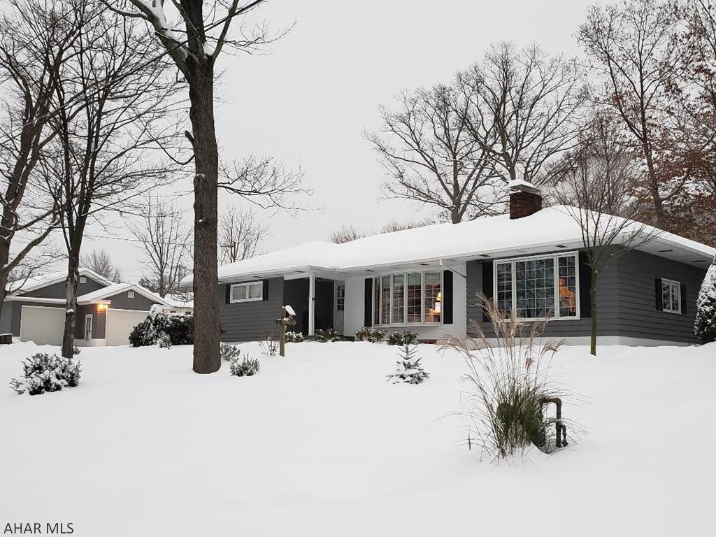 Beautiful 3-bedroom 3-bath home at the end of Washington St.  Home features hardwood, porcelain + ceramic tile floors, chair rail & crown molding throughout main floor, custom-made shelves above windows in Kitchen, Dining Room & Living Room, bath with Jacuzzi tub, natural gas heat + central air, 2 fireplaces + another decorative fireplace & woodburner, seasonal enclosed sun room, finished basement, blacktop drive, shed & large detached 990 sq ft 2-car garage + 2nd lot totaling 1.06 Acre peaceful setting. J-460