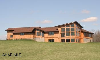 Impressive Contemporary custom built Cedar House on 30.2 Acres with panoramic mountain views. Impressive contemporary custom built cedar house with panoramic mountain views. Open floor plan, 3BR/2BA. Dramatic vaulted ceilings, grand entry with open atrium. Great room w/fireplace, library w/built-in shelves. Conversation pit, hardwood, ceramic tile, recessed and track lighting, stained glass, intercom system. Plenty of windows to bring the outside in! Home has 400 amp electric system. Projected 2010 taxes are $3700. Deed covenants apply.