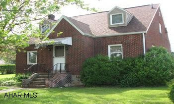 Large brick Cape Cod made into duplex, easily converted back to single family home. Great neighborhood on a 100 x 120 corner lot. Great neighborhood. Keep as duplex or make make nice single family home.