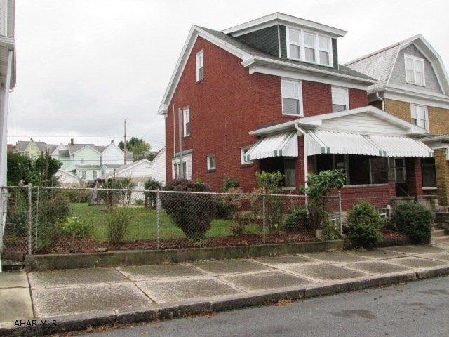 Beautiful brick home with so much to offer!  Semi-open floor plan from kitchen to dining room.  Spacious living room that features a gas fireplace.  Convenient first floor laundry and bathroom.  A finished attic that would make a great 4th bedroom.  Hardwood floor under carpet. Partially finished basement that is great for entertaining.  Large 2 car garage with separate doors.  Gorgeous landscaping, double lot, and off-street parking.  The first time buyer will love all the added features of this terrific home!