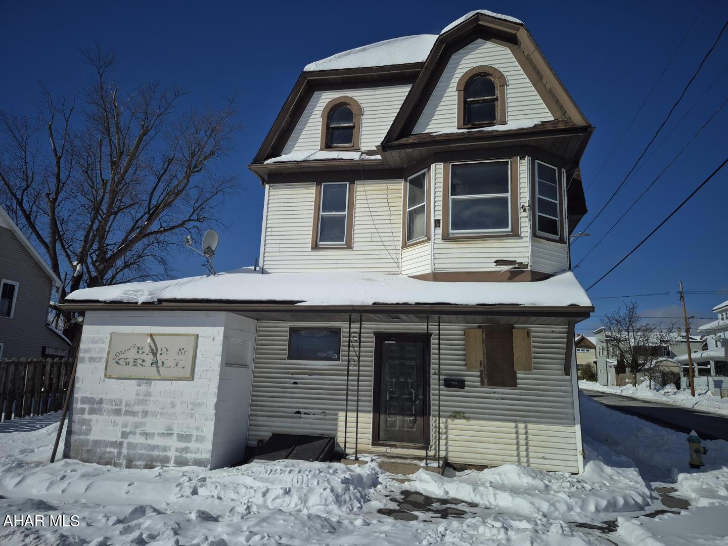 This large property on corner lot was previously used as a bar on first floor, and 2nd and 3rd are setup as possible residences. There is 5 parking spaces in rear of property. New electric service and panels in 2022 - 200amps on 1st floor, 150 amps on 2nd floor, 150amps on 3rd floor. Separate entrances to each floor offers lots of options!  The building  is much larger than it appears. The electric is on to the property but some lights in residential area not installed please take a flashlight. Property being sold in As-Is condition seller to make no repairs. Gas and water/sewe have not been on in seller's name and will not be turn on prior to closing. Contract must reflect. Call listing agent for more information