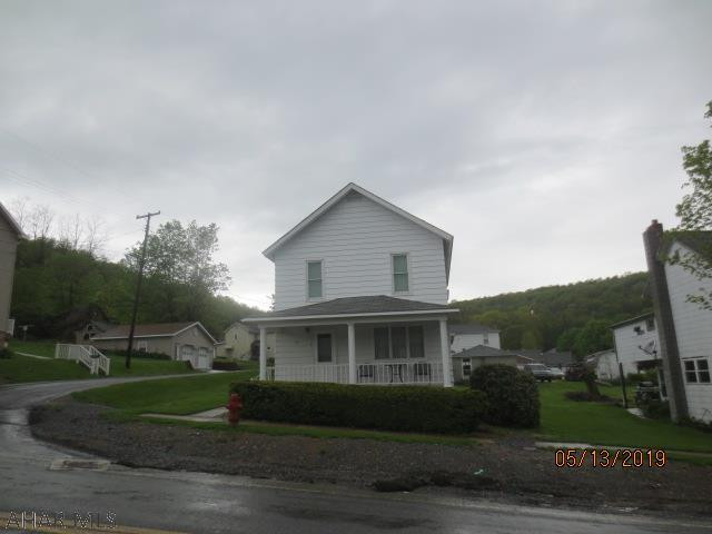 Well maintained home on nice fairly level corner lot and two car garage.