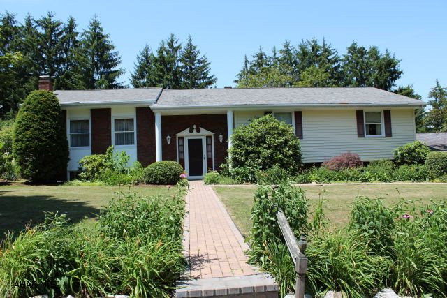 So much to offer!! Country living close to town, spacious rooms with hardwood floors, main level, handicapped accessible complete with elevator, Gorgeous cherry kitchen with corian counter tops, stackable washer and dryer. Lower level offers a mother-in-law option with fully equipped kitchen, 2 baths, family room with fireplace, tons of storage and a possible 4th bedroom. Not GPS accessible - Rt 36 South, first exit past Hollidaysburg to Loop Road, bear right and go 1 mile past exit, turn right on Manor park Drive, right onto Maple Drive, 1 block to Charcoal, first house, red brick, yellow siding.