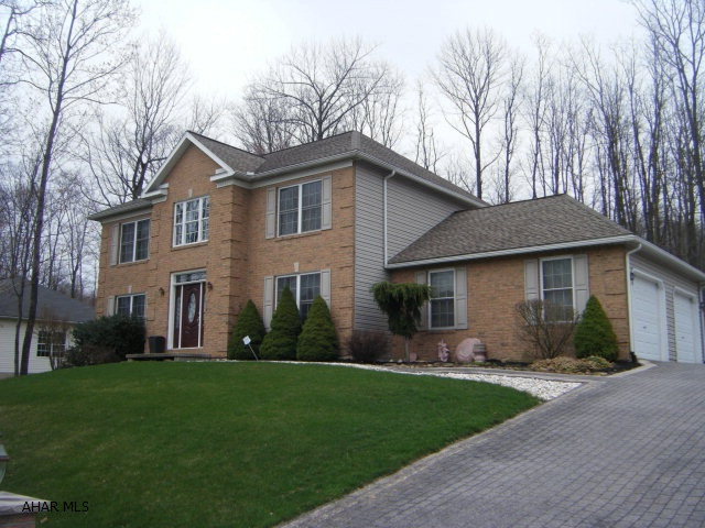 Beautiful home with lots of amenities...2nd floor hickory flooring. Oak staircase/handrail with open ceiling in foyer. Family room in basement with gas fireplace, wine cabinetry, full kitchen, suspended ceiling with wood grids/stained. Full bathroom, furnace room, storage room in basement. Security system ($300/yr). Blacktop drive with stamped effect. Shed. Rear yard entertainment patio. 6 panel solid oak doors 1st and 2nd floors.