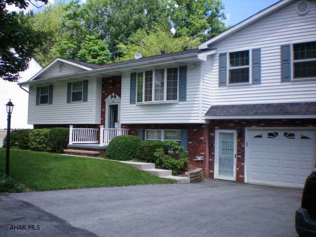 Lovely home in meticulous condition. Totally remodeled plus a large master suite addition. Wonderful finished basement with full kitchen, and bath. Fireplace in family room, a bonus room and a 4 season florida room. 7 zones for heat, well insulated for low heating bills. Large oversized garage and work shop. Back yard with a view and a great neighborhood, conveniently located.