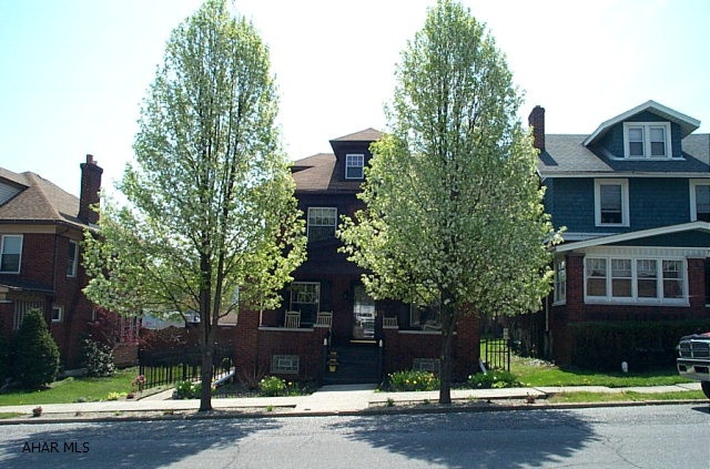 Classic Brick 2 story with complete remodel package. Stunning attention to detail. From tin ceiling in kitchen, staircase woodwork, natural wood floors, completely finished basement, attic bedroom. Artisan quality to the fit and finished.