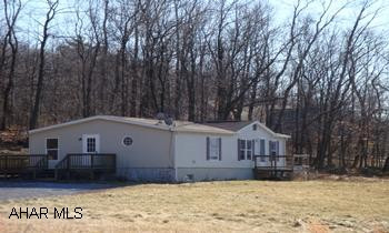 Doublewide on 2.54 acres, private location 3 BR, 2 BA, oak kitchen, partially finished basement.  Buyer must pay 2% transfer tax. Being sold "as is"  Directions: S on 36 to Stop sign, L on Raystown Rd/Rt 26N, go one mile, make right on Price Hill Road, go 1.1 mile to Clark Road on the Right, follow to the end.  Doublewide on the left.  Buyer must pay 2% transfer tax.