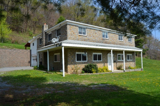 Custom block structure with plaster interior walls,ceramic tile floors in kitchen and bath and marble window seals. Spacious raised ranch home that could be easily converted to a three family dwelling. Aprox 70ft of land will be conveyed to neighbor prior to closing of property.