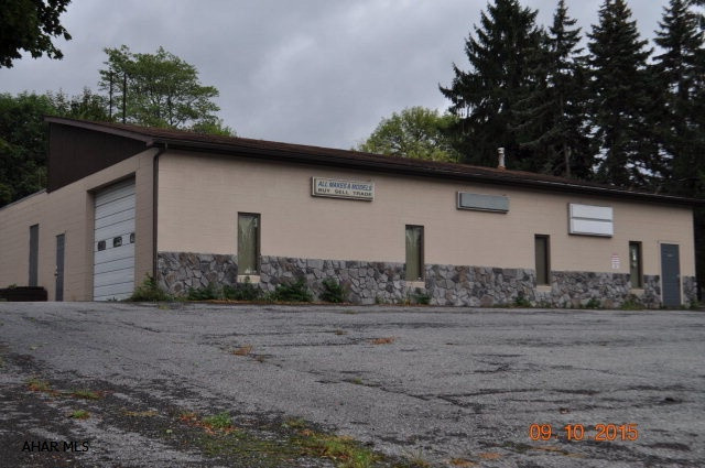 Fantastic business opportunity in the Greenwood area.   High traffic location.   Large commercial building with a large show room and retail space.   This would be perfect for many types of business.   Large office space.  This building has both heat and central air.    Large paved parking lot. The building has a Logan Township Occupancy permit from the Commonwealth of PA. The garage doors are 10 feet tall.   The ceilings in the front of the building are 14 feet high and the back of the building are 8 feet high.
