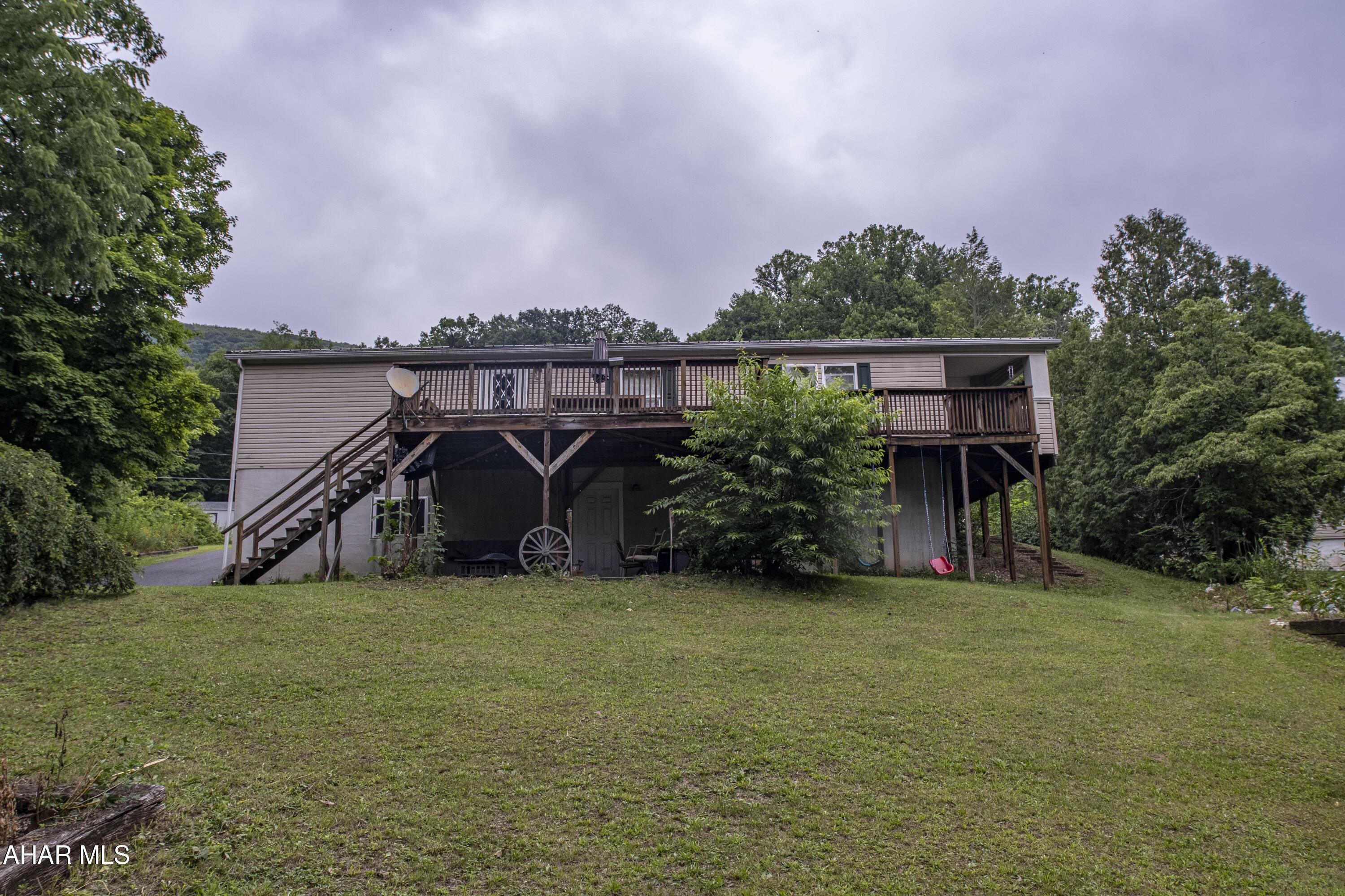 Welcome to 19978 Uttley St., Saltillo, PA! This charming home offers the perfect blend of comfort, privacy, and outdoor living. The bright open-concept floor plan creates an inviting space that is perfect for both everyday living and entertaining. Step outside to your own private backyard oasis featuring a spacious deck, above-ground pool, and relaxing hot tub - ideal for summer gatherings, family fun, or simply unwinding after a long day.                                                       

Enjoy added peace of mind with a solar-powered Blink security system, providing convenient, energy-efficient home monitoring. Plus, the seller is installing a brand-new furnace, offering improved comfort, efficiency, and added value for the new owner. The full basement provides abundant storage and endless potential to finish into a family room, home gym, game room, or additional living space. An attached garage and large paved driveway offer plenty of parking for multiple vehicles, guests, or recreational equipment. Nestled in a peaceful setting with the privacy you've been looking for, this home offers the space and versatility to fit a variety of lifestyles. Don't miss your chance to make it yours!