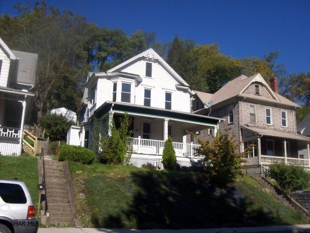 Big beautiful home, very sunny and bright with lots of windows, all hardwood floors, two fireplaces, new windows, second floor laundry, new boiler in 2010, wraparound front porch and rear patio.
