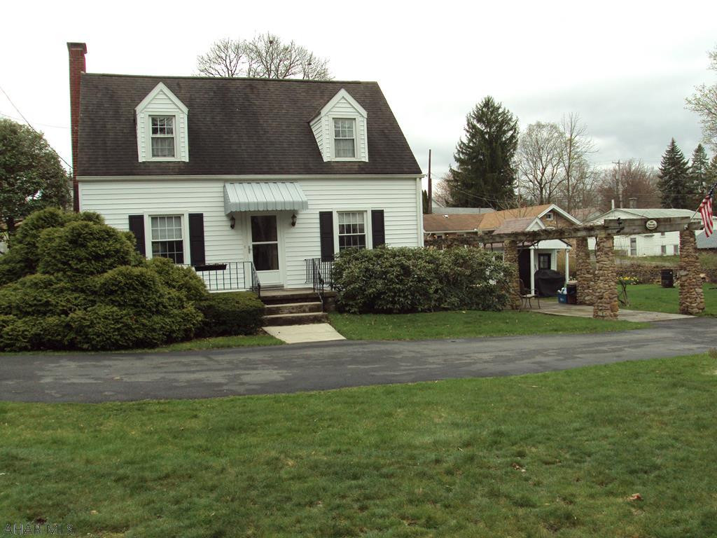 Very nice 3 Bedroom 2 Bath Cape Cod.  Hardwood floors, bedroom and bath on first floor, 2 Bedrooms and Bath on second.  Large Living Room w/ converted gas fireplace.  Formal Dining Room.  Relaxing Sun Room, Riverstone Grape Trellis, Garage with Electric, Gas, Water, Sewage, Fireplace