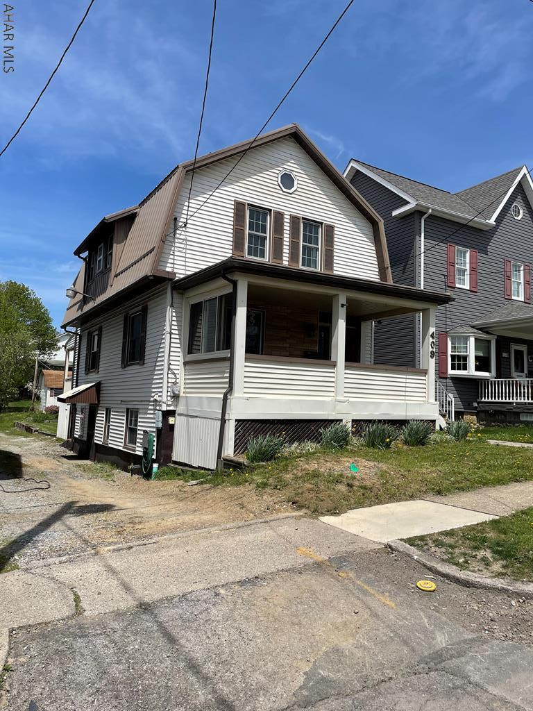 This 2 story 3 bedroom 1.5 bath house sits in the heart of Ebensburg. Enjoy your morning coffee on the covered front porch or relax with your favorite beverage watching the sun set. The foyer offers a place to hang your coat as you enter the home. The living room and dining room connect, great for entertaining and the floors have been refinished. The kitchen features new flooring and newer appliances that are included.  The bonus room has 1st floor laundry and right off of that is an updated half bath.  The composite deck is great for grilling out.  Three bedrooms upstairs, two of which have bonus areas/closets. New carpeting on second floor. L shaped bath has been updated as well and offers lots of storage. Basement has a bonus family room. New roof.