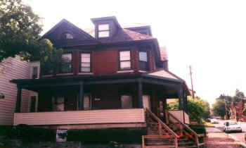 CLASSIC 2.5 STORY BRICK IN GOOD CONDITION.  EASILY CONVERTED TO DUPLEX.