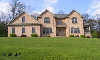 Over 4,000 square feet of living space in this wonderful custom built home with superior craftmanship and flowing floor plan. Beautiful hardwoods in the foyer, throughout  the eat- in kitchen, diining area,  stairway and laundry area. Cherry cabinetry,wall oven and warming drawer compliment the kitchen and serving area off the formal dining room. The sitting /living room has its own private covered side porch and the family room houses a beautiful black granite fireplace.The 2nd floor with its large open hallway features 4 bedrooms including a great master suite with garden jacuzzi tub and 2 huge walk-in closets.Finished lower level could be a separate living space with its recreation room ,exercise room and separate entrance and there is room for a kitchenette too.  2 large walk in closets in the other bedrooms. This custom home, built by Metz Builders, is situated on a lovely 0.77AC private wooded lot and features a 3 car garage, zoned heating and cooling and great screened porch. Call Dianne Stultz 329-1856.
