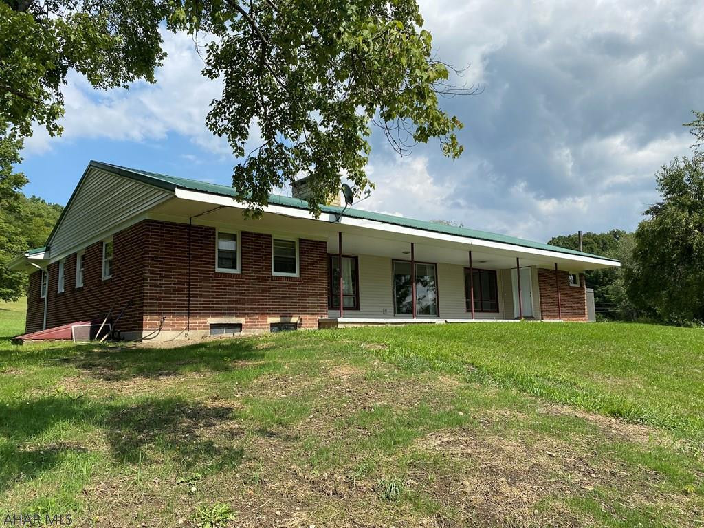 JUST SHY OF 7 ACRES, this solid home with a country setting includes updates such as flooring, baths, newer heating unit, radiant floor heating system newer appliances with an eat-in kitchen and ample counter and cabinet space. There are 3 bedrooms, full bathroom, and a modernized private half bathroom off of the owners suite. The basement is partially finished and features a large rec room and office area, secluded laundry area, and abundant storage space.  Backyard was dug up to upgrade septic lateral from terracotta pipe to PVC.  Septic tank has been pumped and inspected within the last year.  Electric panel, outside weather head and service entry cable has also been inspected within the last year. Outlets have been upgraded to meet the standard NEC.  Seller is listing agent.