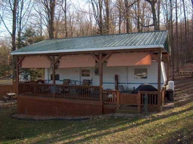 Out standing 2006 Dutchman Camper w/ bunk room, master bedroom, pavilion w/ deck, shed. A great area to enjoy a camp fire.