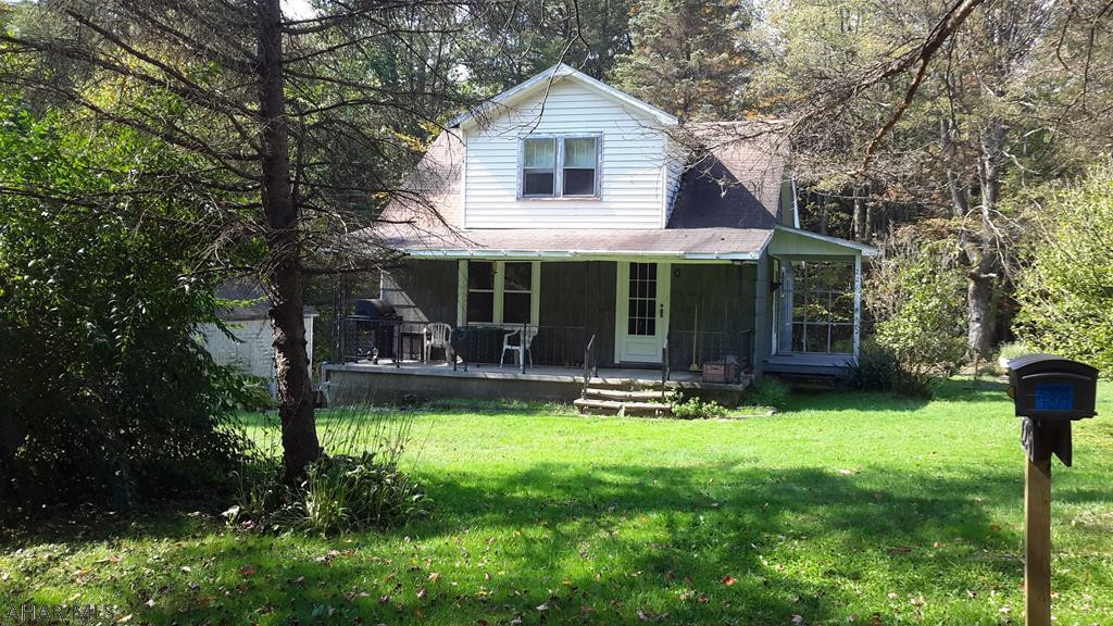 Nice home in the country with room to grow.Put your personal touches on this 3 bedroom home  that sits on almost an acre. There have been some updates done but the possibilities are endless. First floor living with detached garage and a covered porch for relaxing, Call to tour this home that is priced to sell!
