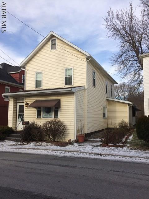This beautifully maintained home has plenty of space and is larger than it looks. There are many updated throughout this home. Off of the updated kitchen is a half bath/perfect for entertaining family and friends. The first floor laundry room features wall to wall cabinets for plenty of storage. Beautiful hardwood floors are throughput this home. First floor has a bonus space that could be used as an office. Second floor has 3 spacious bedrooms with plenty of closet space. Walk up attic is great for storage. This home has a covered back deck and also 2 car detached garage. Included the sale of this property is a vacant lot across from VFW. Call us today.