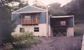 Raised rancher. 2 bedroom, 1 car garage. Sold as is. Needs TLC.