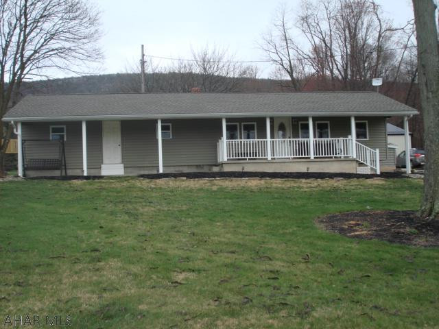 This exceptionally well cared for home has been completely renovated. Originally, a singlewide mobile home. The exterior was removed & foam insulation placed on the exterior prior to installing the present siding. The bathroom was completely remodeled w/ double sinks, granite tops, full tub/shower, ceramic tile floor & a spacious closet w/full length mirrored doors. The bedrooms have ample closet space. The living room is complimented by a wood burning fireplace. The dining room offers both table dining & counter top dining. The kitchen has a commercial size double bowl sink & up to date appliances. On the outside you will find a lovely front porch, a back patio,  a commercial garage (30x40), an attached garage (23x14)  & a shed.  New roof and windows, updated wiring & central A/C.  HURRY!