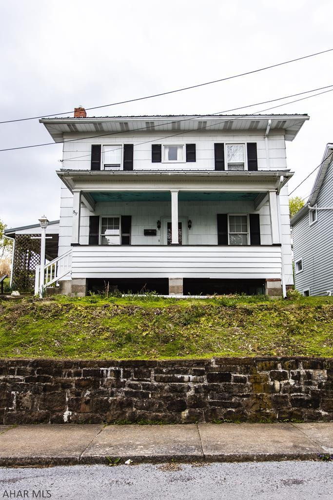 Cozy 3 bedroom, 2 full bath house. Front porch, large 2 car garage and off- street parking.