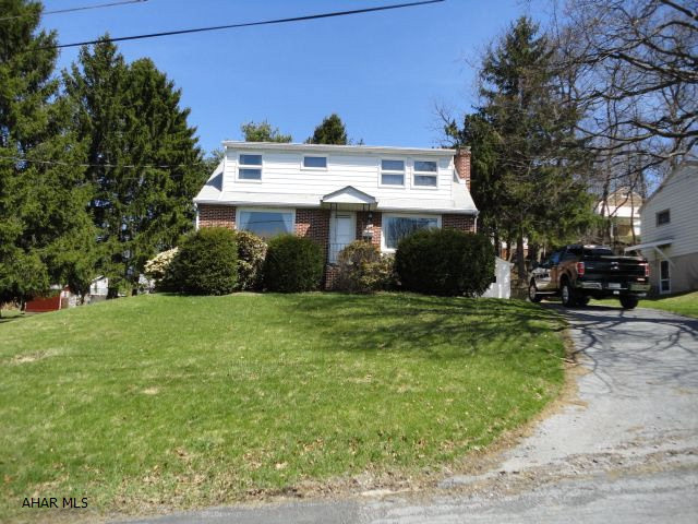 Hardwood floors, nice area, large 2 car garage, lots of potential.