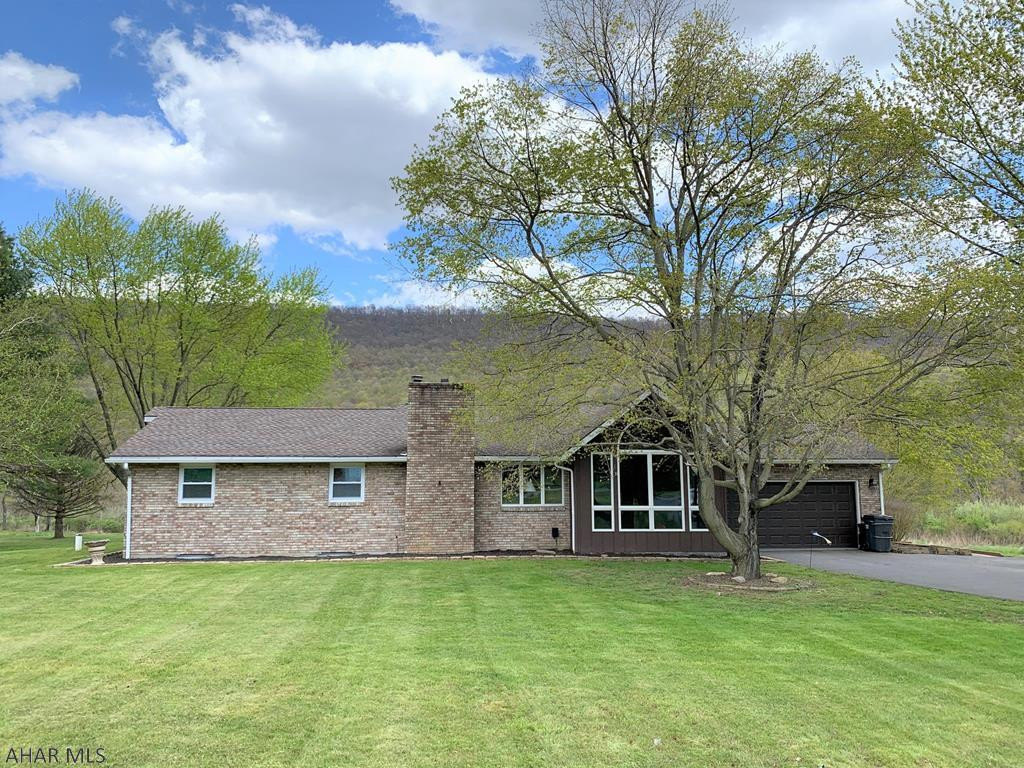 This custom built home is well maintained & move-in ready!! Large sun room w/ cathedral ceiling, great room w/ mountain views & oak built-in, kitchen having updated appliances, dining room/sitting room w/ oak floors & french doors, three bedrooms & an updated full bath. Basement is finished w/ a large rec room, stone bar, stone fireplace w/ wood burner insert, laundry room & another full bath. Two-car attached garage, blacktop driveway & large 2-acre lot. Relax on the rear deck or paver patio & enjoy the in-ground swimming pool or just gaze at the scenic mountains. Heat pump w/ central air-conditioning, 200-amp electric, private well & private septic. Nice updates throughout & well cared for. Convenient, central location between Bedford & the PA/MD border, Rocky Gap, I-68, & Cumberland.