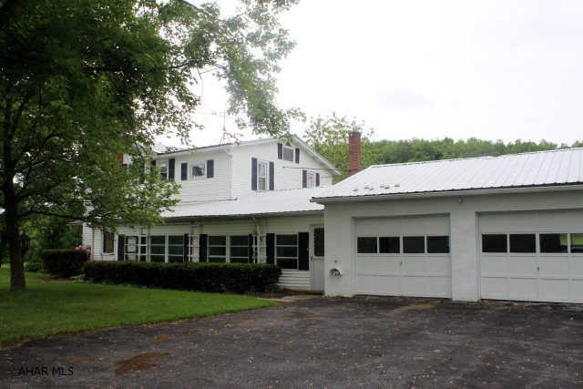 2 story farm house with well-maintained features and charm. 10.76 acres, easy access and a 68x39 bank barn make this a desirable property for a full-time residence or hobby farm. Acerage is open, maintained and nicely set for horses, hobby or ready for new planting. House has some built-ins and 2 zoned heating.