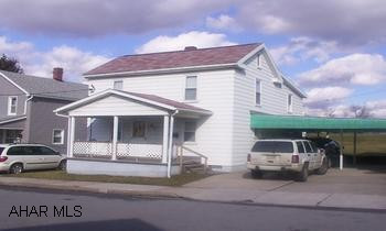 Sharp 4 bedroom.  New vinyl windows, aluminum siding, updated wiring, carport, large level lot.  All appliances.