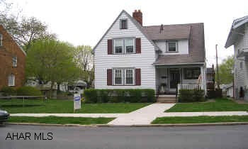 VERY CHARMING AND WELL MAINTAINED.  GREAT LIVING ROOM AND DINING ROOM WITH HARDWOOD FLOORS.  MODERN KITCHEN AND BATHS.  THIS HOME IS A MUST SEE!  FENCED LOT, LARGE DECK.  1 CAR GARAGE.