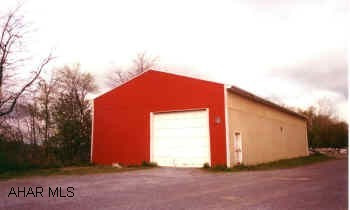 METAL STORAGE BUILDING 32'WX80' LONG. 12'X12' OVERHEAD GARAGE DOOR. ON APPROX. 3.5  ACRES. LOT SIZE IS APPROXIMATE. SALE SUBJECT TO SUBDIVISION.