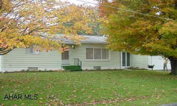 COZY RANCH W/HARDWOOD FLOORS,BREEZEWAY,2 CAR GARAGE AND AN EXTRA LOT CITY SEWER GOING THROUGH IN 2005