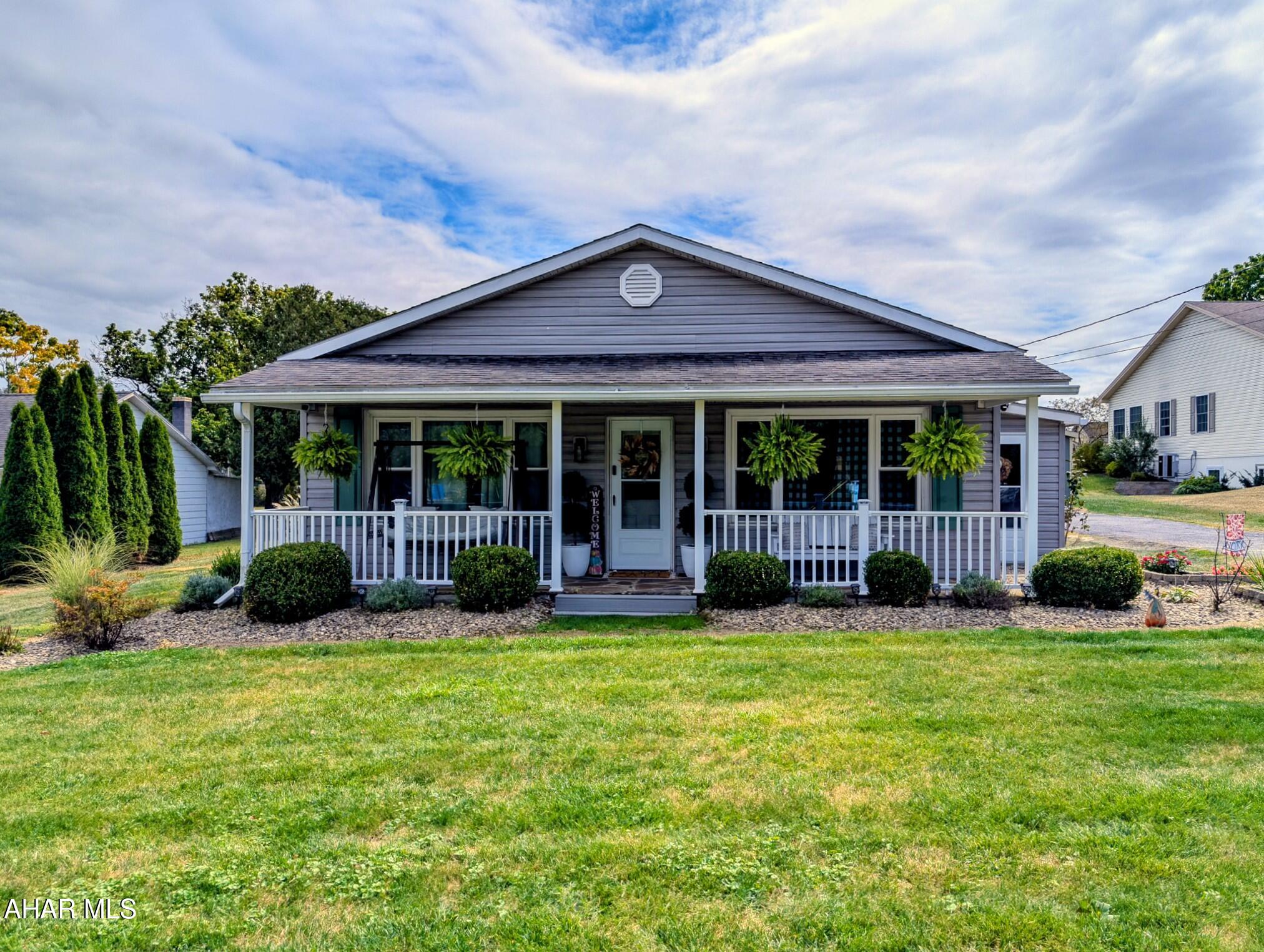 You will absolutely love this clean, easygoing 1,380 sq ft bungalow sitting on a level .67 acre lot in the Chestnut Ridge school district. It's truly move in ready, no rehab, no fuss, just bring your things and start living. Enjoy morning coffee on the covered front porch and evenings on the covered rear patio. Above ground pool for hot days and a detached 2 car garage for parking, projecting or storage. The yard is big and flat, so whether you want a garden, play space, or room to expand, you've got options. Inside, the layout is practical and bright with well kept finishes throughout.  Spacious living areas, updated bathroom, flooring, carpeting and more.  If you're looking for a turnkey home in a great school district, this one is sure to check all the boxes. Give us a call today to make this wonderful house your new home!
