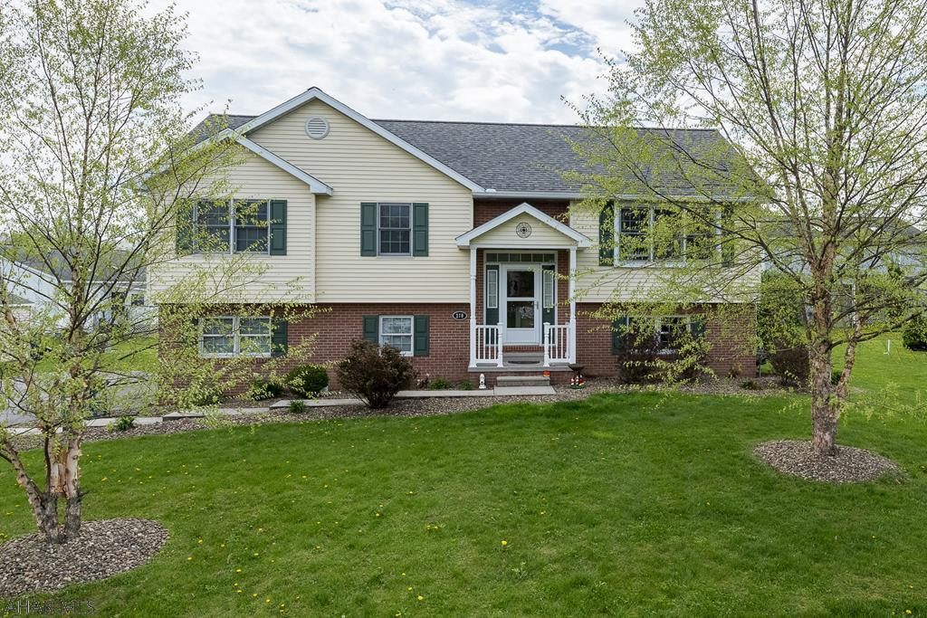 This lovely Brick and vinyl split level home is located in a desirable neighborhood close to the Frankstown Elementary School.  Three bedrooms and two full baths (just remodeled) are located on the main level for one level living.  10 x 10 Covered deck with ceiling fan is right off the dining area.  Tasteful light fixtures throughout and swirled ceilings.  The lower level offers a finished family room with a stone fireplace and 1/2 bath.  Driveway leads to a 2 car oversized garage.  A must see!