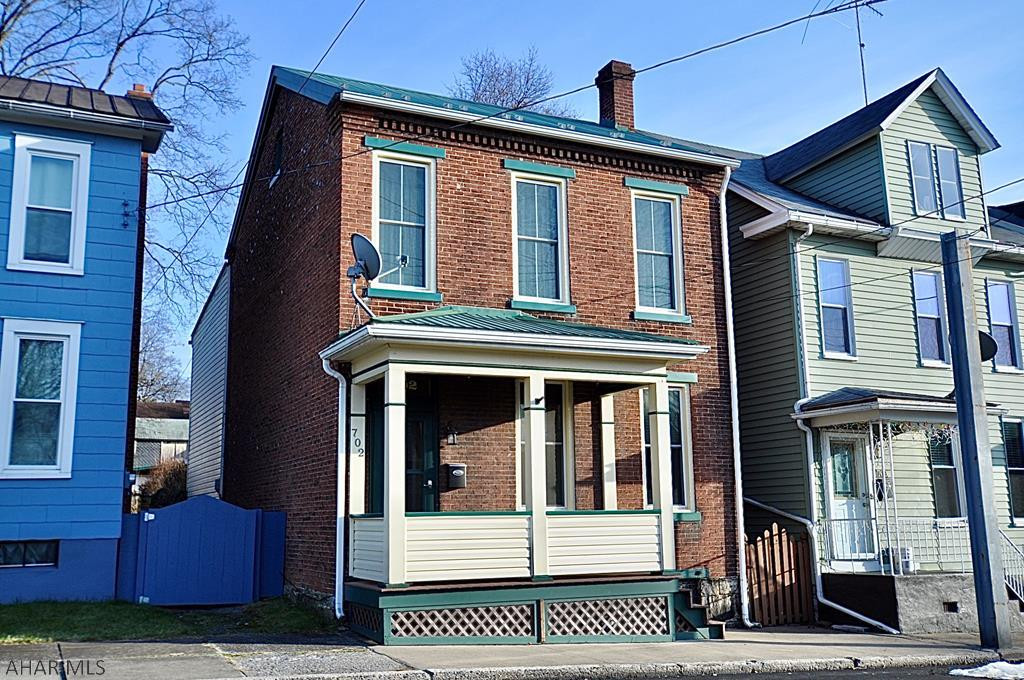 This sweet brick 2 1/2 story home has lots of charm, low taxes, and is clean and read to move in! Modern bathroom and kitchen, new metal roof, lots of replacement windows, modern 100 amp electrical panel, natural gas hot air heat and hot water heater, great fenced in rear yard, 1 car detached garage with attached carport ... this is a wonderful, inexpensive home that is move in read!