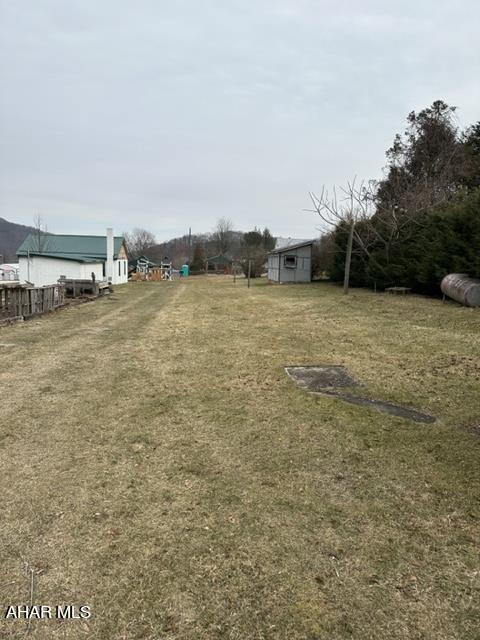 Improved building lots with available public water and sewer. Water and sewer have been capped off.  Shed is on the back of the second adjoining lot. To build home or install trailer please check with Liberty Twp. on variances.  Previously there was a trailer and has been removed all but the 250 gal. oil tank. The lot was leased to the owner of the trailer.
Electric pole is still in place.  The one lot contains .138 acre and adjoining .051. Adjoins unimproved alley.