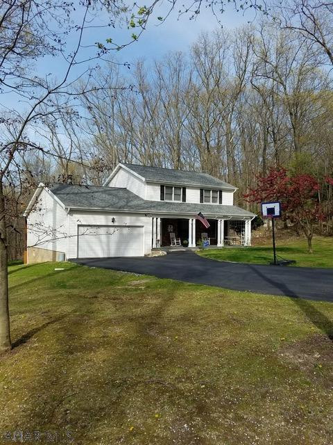 Beautiful home nestled in the woods of the Bellmeade area! As you enter this well maintained home through the foyer you will find the large living room, dining room, large eat in kitchen, 1/2 bath, laundry room and family room with a wood fireplace on the 1st level. The wide staircase will take you to the 2nd level where you will find the full bath, hall linen closet and 3 bedrooms, one being the large master bedroom with 2 closets and 3/4 bath! So many updates like a new roof, pellet stove, new hot water tank, 3 filter water filtration system just to mention a few. Enjoy the wild life as you relax on the back porch overlooking the flat yard with large shed and plenty of room to entertain around the fire pit area.  Must see family home! Call today to schedule your showing, it will go fast!