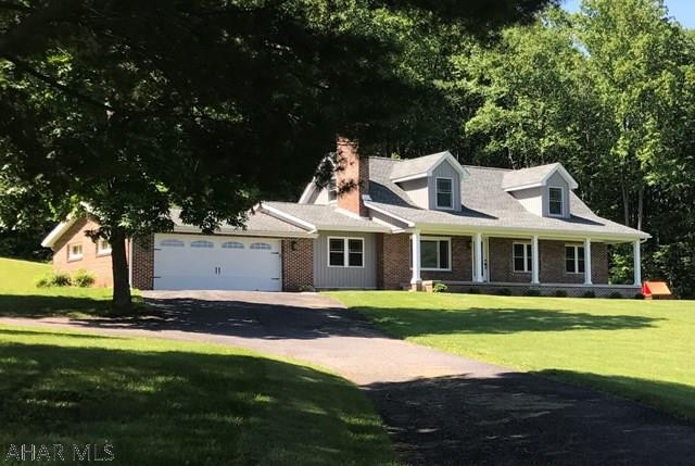 Gorgeous renovated home with 18 +/- acres nestled in the hillside with stunning views. A large covered front porch opens onto an open concept great room with spacious kitchen. The sunroom with abundant natural light is adjacent to the great room making entertaining a joy. The convenience of large main floor master suite with huge walk in closet and amazing master bathroom will delight even the most discriminating buyer. A guest bathroom & laundry room complete the first floor. A bedroom and huge bonus room with additional beautiful guest bathroom complete the second floor. Too many updates to list. Must see to appreciate!