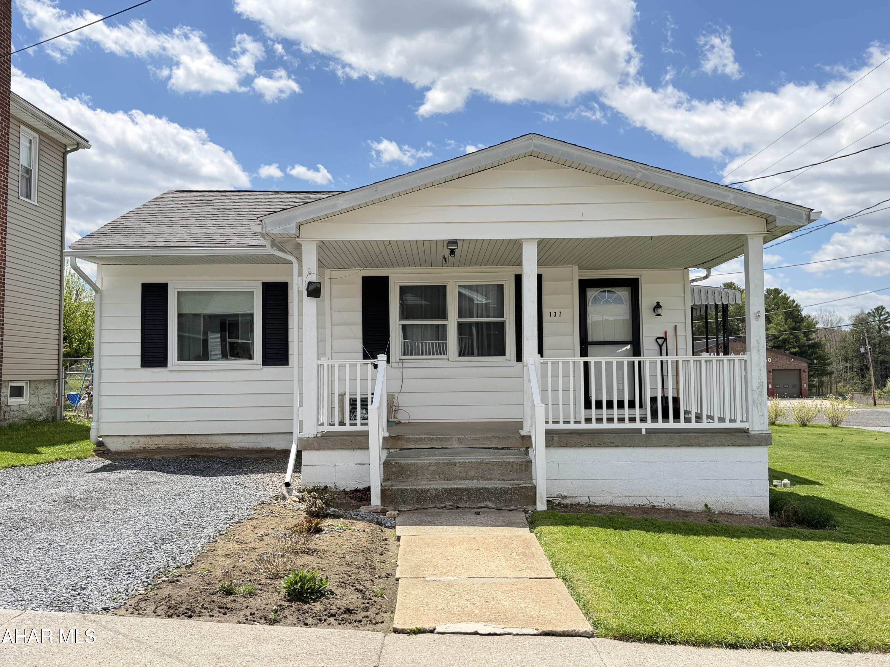 Welcome to this move-in-ready gem in the heart of Ashville Borough! This clean 2 bedroom 1 bath home sits on a perfectly level lot making this easy to maintain.  Step up to the large front covered porch, the ideal spot for your morning coffee or greeting neighbors. For summer cookouts, you will love the convenient side porch, perfectly situated for your grill. Inside the home features a functional layout designed for easy living. The inviting living spaces feel bright and airy, while the two bedrooms provide cozy retreats at the end of the day. The updated 3/4 bath finishes off this floor. Location is everything! You are just steps away from local walking trails for outdoor exercise and conveniently close to the firehall. Whether you are looking for a starter home or a simplified lifestyle, this charming property is a rare find in a great community.